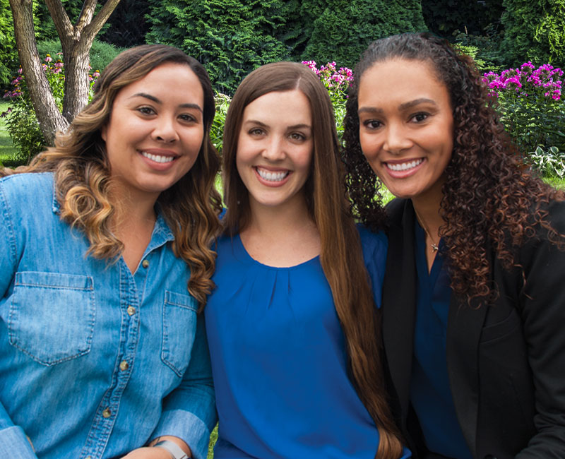 three smiling ladies